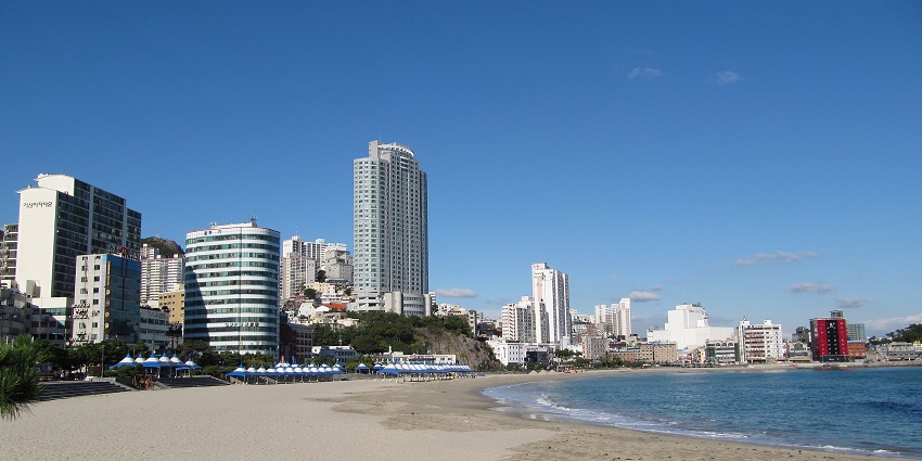 Popular beach offering a boardwalk, clear waters, and entertainment