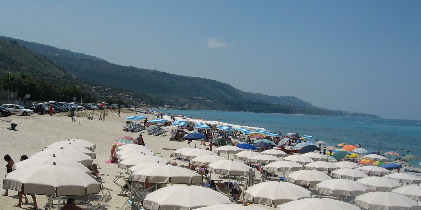 Tourists enjoying at sardinia beaches in italy--best places to spend sunny day