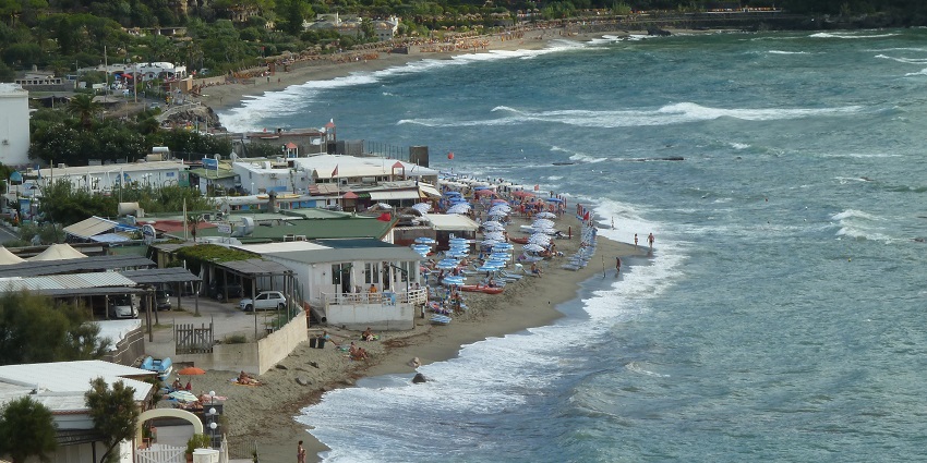 Boats stacked at the shores of Spiaggia di Citara Beach near Naples in Ischia.