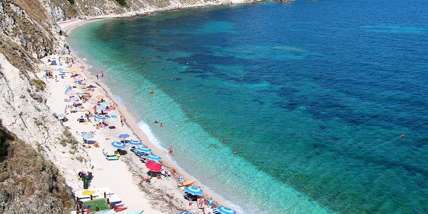 Unwind at Spiaggia di Sansone, one of the must visit beaches in Italy