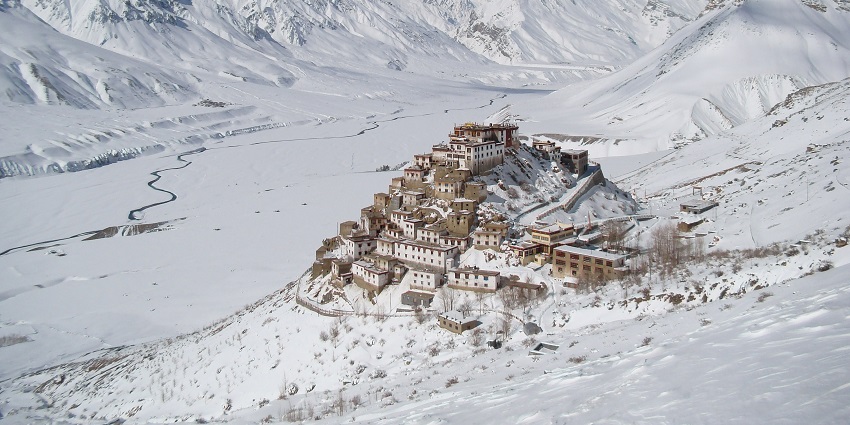 View of Key Monastery surrounded by snowy Spiti Valley in Himachal Pradesh.