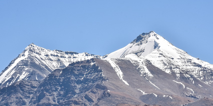 Majestic snow-covered Kanamo Peaks in Spiti Valley in Himachal Pradesh