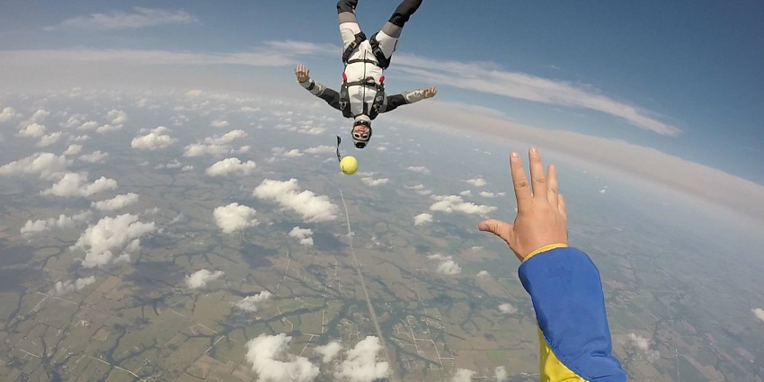 Experience thrilling skydiving in the UK with breathtaking views of Scotland’s coastline and lush green landscapes from above.