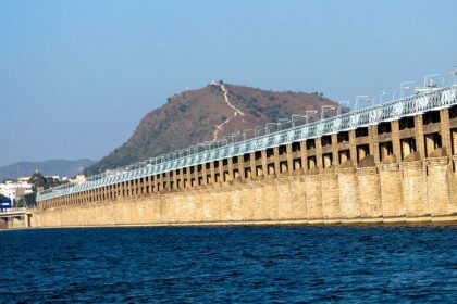 Serene scene of Vijayawada, showing the bridge amidst the greenery.