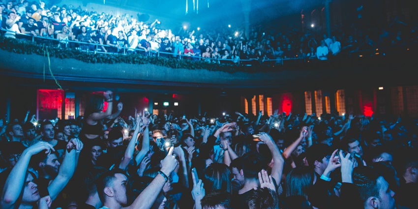 A glamorous nightclub with dazzling lights, international DJs, and a luxury nightlife