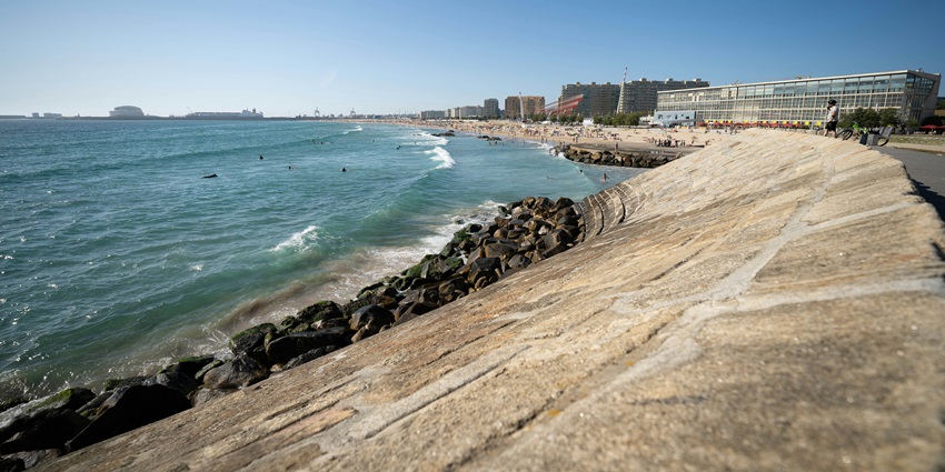 Surfers enjoying the waves at Matosinhos Beach a popular surfing destination.