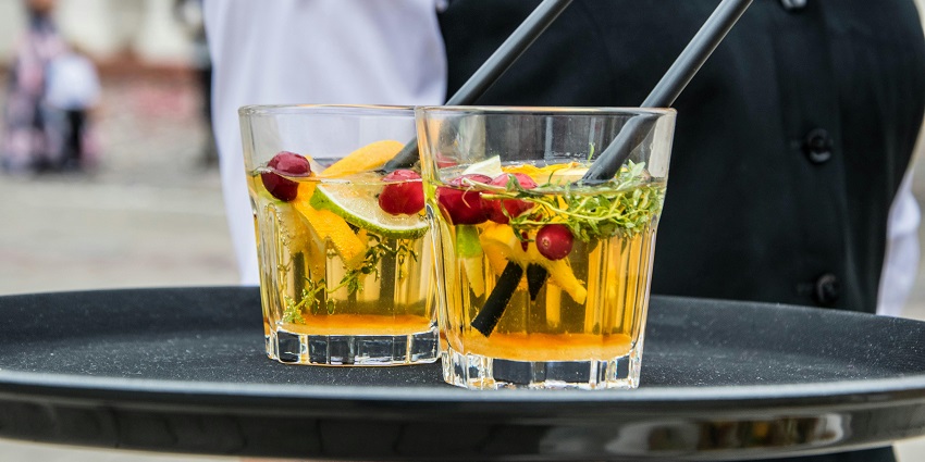 Image of 2 Whisky Glasses Filled With Beverage on Black Tray