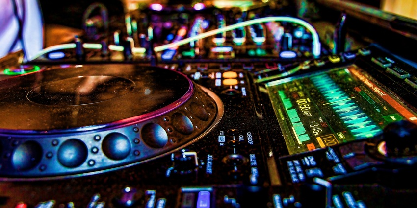 An inside view of the iconic Tabačka Kulturfabrik featuring a DJ’s live performances.