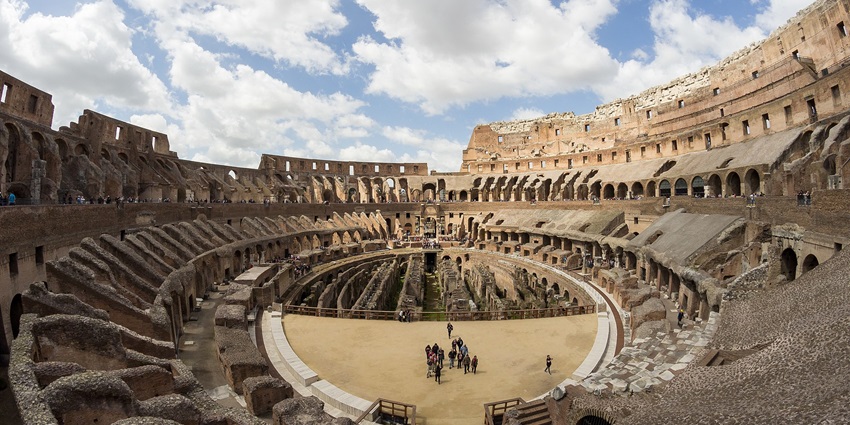 Tourists exploring the interior of the Colosseum, one of the top things to do in Rome