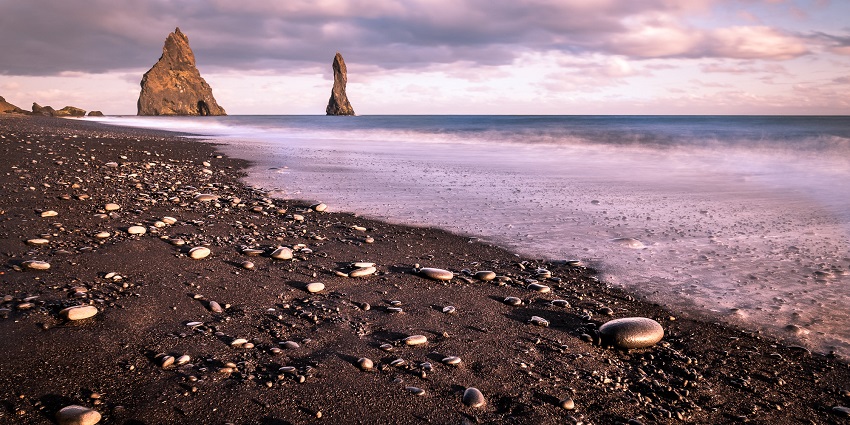 An image showing the Black Sand Beach in Iceland, captured beautifully in travel photography.