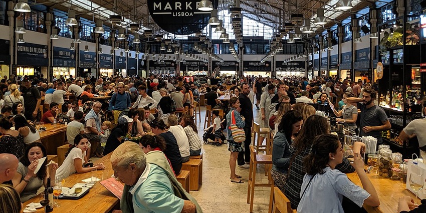 Various food outlets to try in the Time Out Market hall which is a famous food hall.