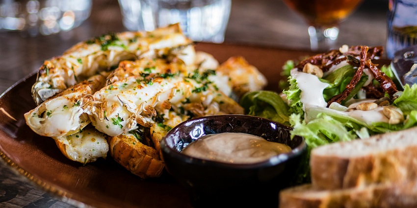 Image of a food platter with delectable dishes Milan Nightlife: Experience the Aperitivo Tradition