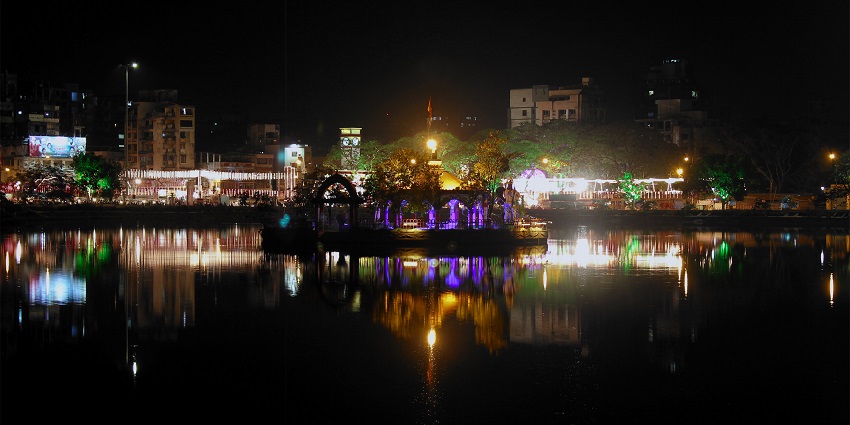 Picturesque lake offering boating and peaceful leisure activities, showcased in the Thane city guide.
