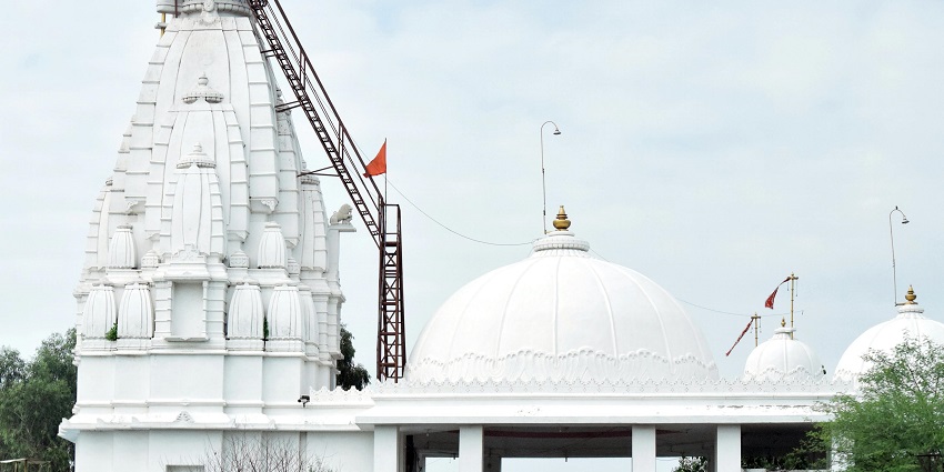 Tapkeshwar Mahadev Mandir in its tranquil surroundings, visited by devotees.