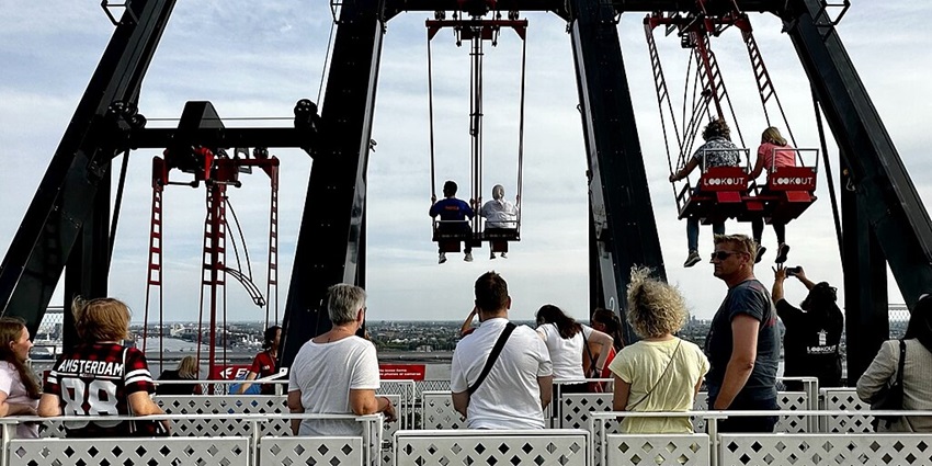 People swinging on the roof of A'DAM -wer.