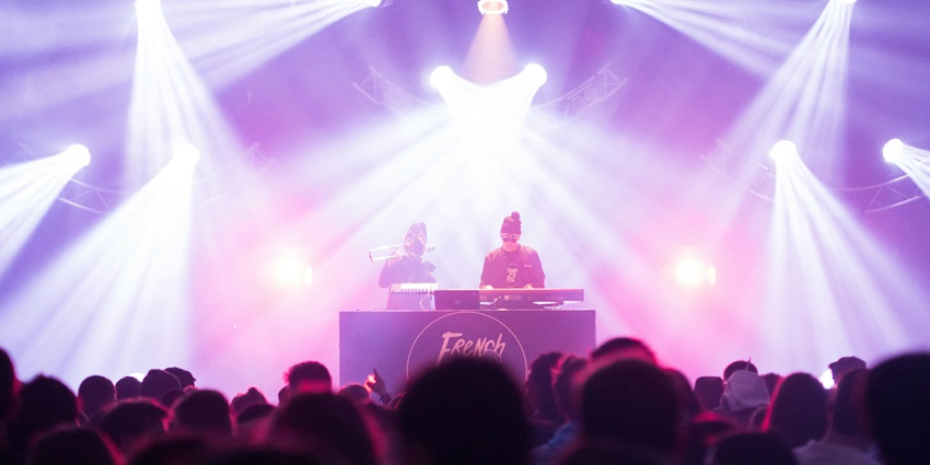 An image showing a crowd enjoying the loud music similar to the Tausend bar in Berlin.