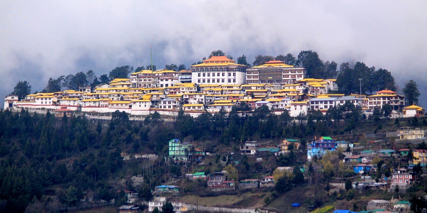 An image showing Tawang Monastery in Arunachal Pradesh, with its large structure on a hillside