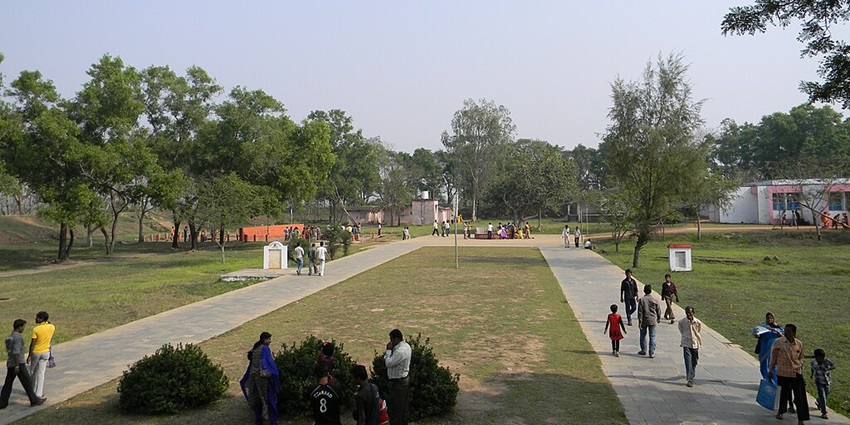 An image of people at the Atri Springs in Khordha, Odisha, one of the famous hot springs in India.