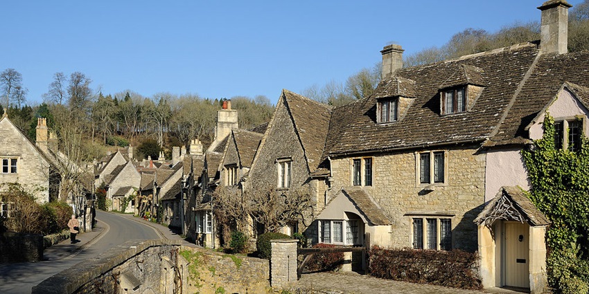 Charming countryside with honey-coloured cottages and rolling landscapes.