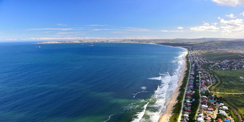Aerial view of the Garden Route in Eastern Cape with blue waters, sand and mountains with greenery
