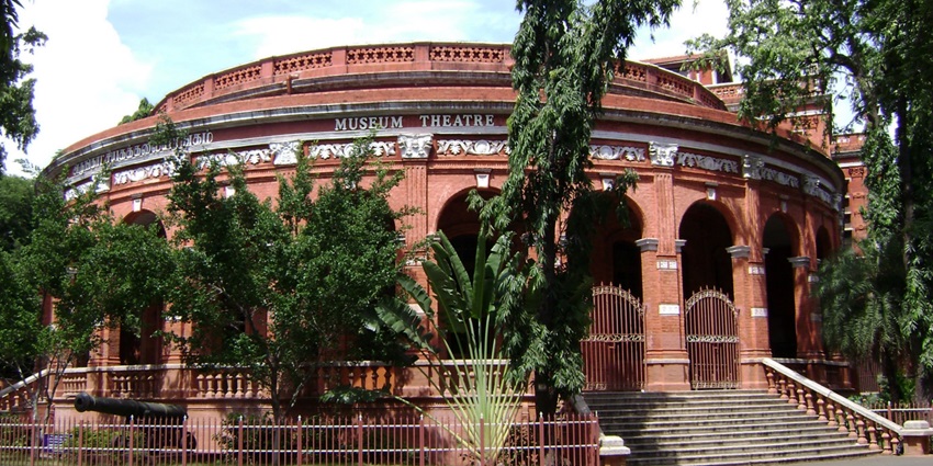 An outside view of the The Government Museum in Chennai, surrounded by lush greenery