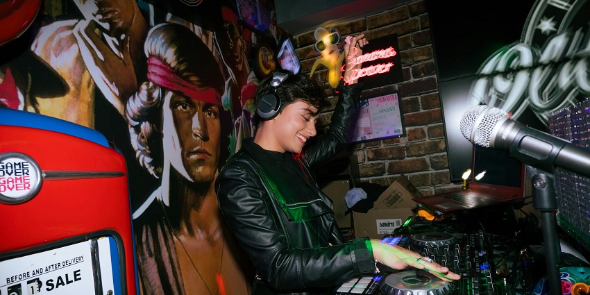 An image of the DJ setup, surrounded by colourful lights, for an energetic night to enjoy Pune nightlife.