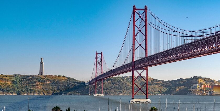 An aerial view of the stunning city of Lisbon and Golden gate bridge - things to do in Lisbon in December