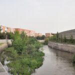 Beautiful snapshot of a canal passing through the landscape in Madrid.