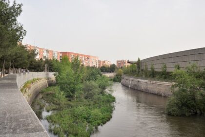 Beautiful snapshot of a canal passing through the landscape in Madrid.