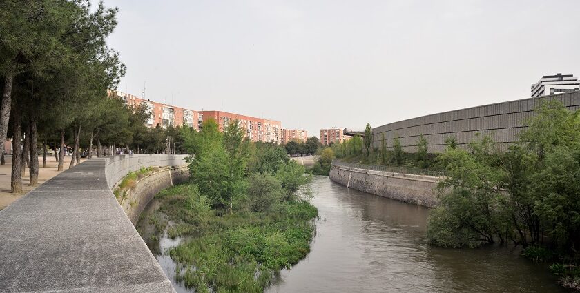 Beautiful snapshot of a canal passing through the landscape in Madrid.