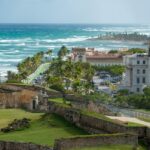 El Morro fortress in Puerto Rico, overlooking the coast with buildings in the distance