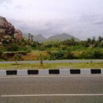 A panoramic view of Salem, Tamil Nadu, with lush hills and scattered urban landscape.