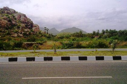 A panoramic view of Salem, Tamil Nadu, with lush hills and scattered urban landscape.