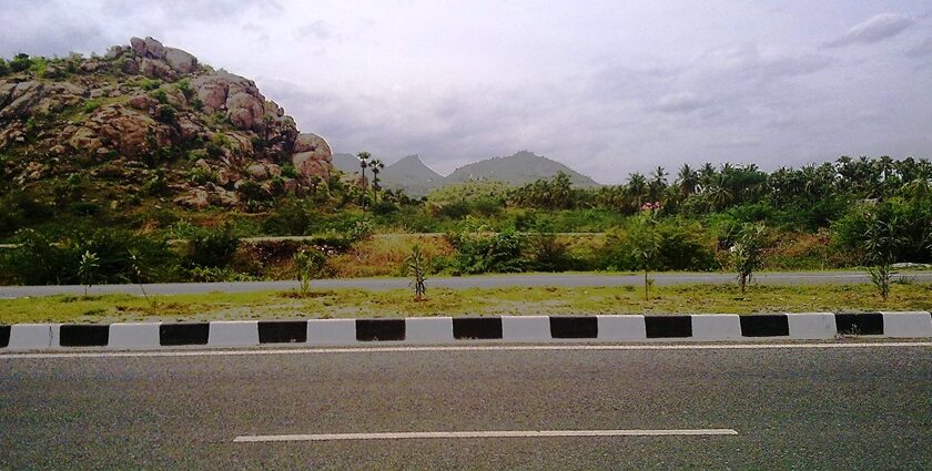 A panoramic view of Salem, Tamil Nadu, with lush hills and scattered urban landscape.