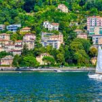 Tourists enjoy the serene lakefront , one of the best things to do at Lake Como.