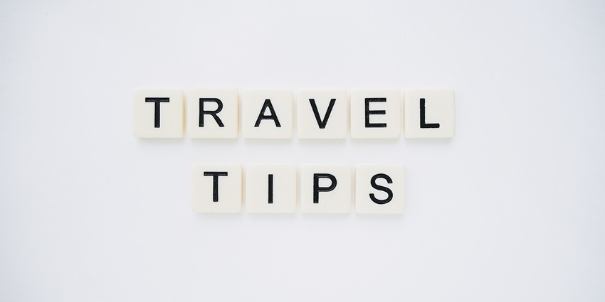 An image displaying the phrase 'TRAVEL TIPS' against a backdrop, offering useful advice for travelers.