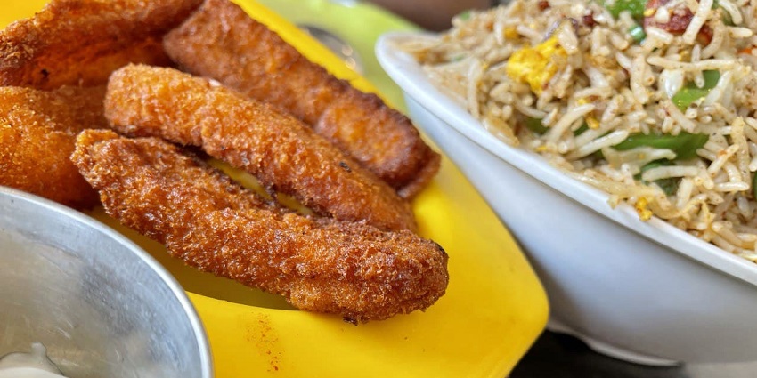 Finger licking juicy finger fish along with spicy hot chicken fried rice, as mentioned in the Tamil Nadu travel guide.