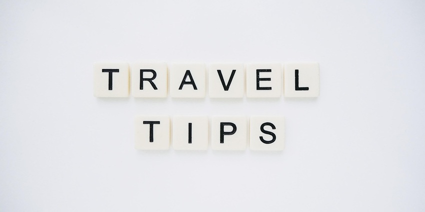 An image displaying the phrase 'TRAVEL TIPS' against a backdrop, offering useful advice for travelers.