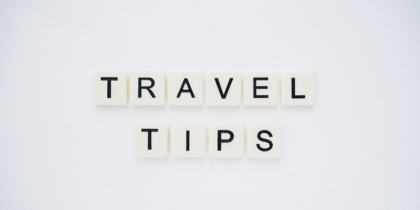 An image displaying the phrase 'TRAVEL TIPS' against a backdrop, offering useful advice for travelers.