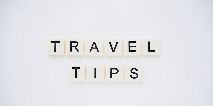 An image spelling 'TRAVEL TIPS' on background, suggesting helpful advice for travellers