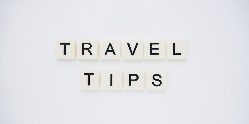 An image spelling 'TRAVEL TIPS' on background, suggesting helpful advice for travellers