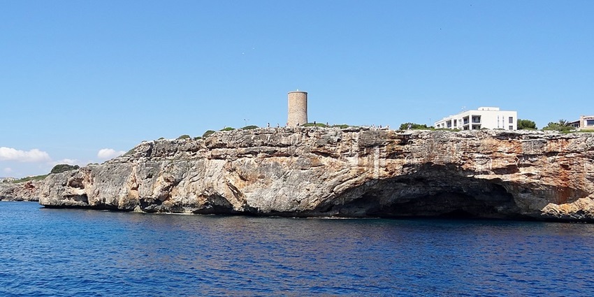 Climb to history and stunning sea views at Torre del Serral near Caves of Drach, Spain.