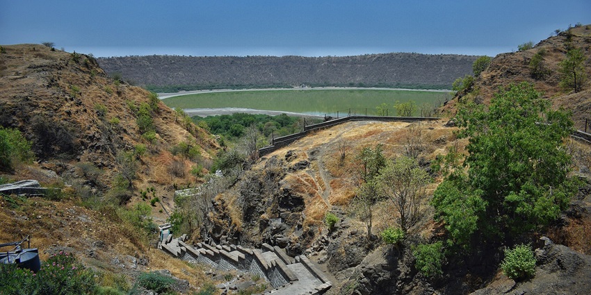A view of Lonar Lake shows its long rim, a perfect spot for a moderate trekking session.
