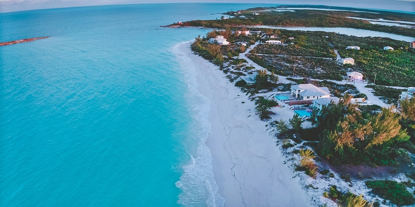 Serene turquoise waters meet soft white sand at Tropic of Cancer Beach, Exuma