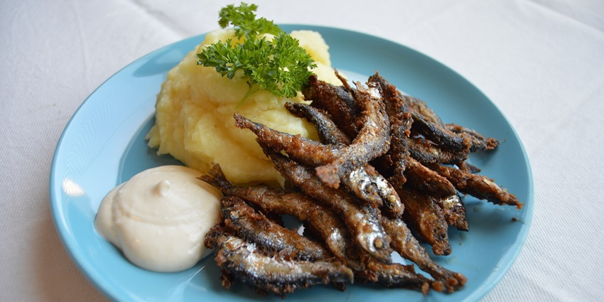A plate of fried vendace, one of the most famous traditional foods to eat in Finland