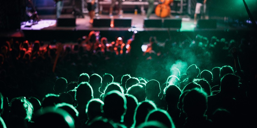 People celebrate New Year in Italy under the green light while dancings and vibing.
