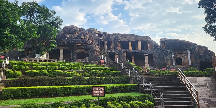 Udyagiri and Khandagiri caves with old architecture and greenery with no-entry signage