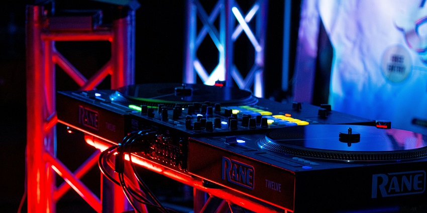 DJs playing an energetic playlist for guests to witness a thrilling night.