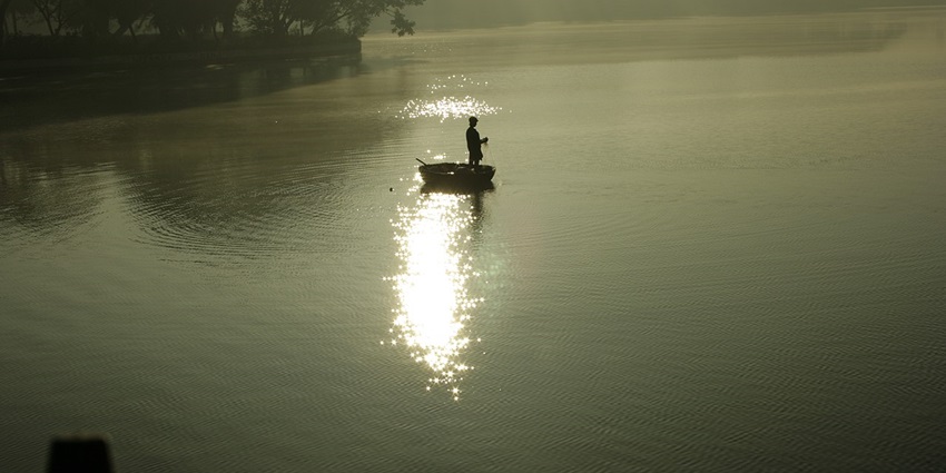 The scenic view of fishing in Ulsoor Lake, which was one of the famous lakes in Bangalore.