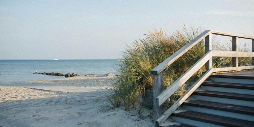 Image of a wooden pathways towards the Ustka Beach in Poland